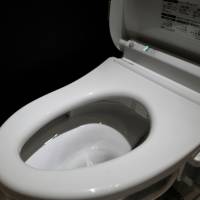 A model of Toto Ltd.\'s Tornado washing toilet is displayed at the company\'s showroom in Tokyo in 2016. The toilet maker is boosting its production capacity in Thailand to meet global demand. | BLOOMBERG