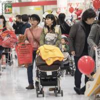 Shoppers move through the toy department in an Ito-Yokado Co. store in Tokyo. Wholesale prices rose 3.5 percent in November from last year, the fastest pace since September 2014. | BLOOMBERG