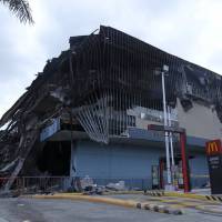 A mall is seen on Friday after it was gutted by a fire in Davao, the Philippines. | REUTERS