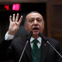 Turkish President Tayyip Erdogan addresses members of his ruling party during a meeting at the parliament in Ankara on Nov. 7. | REUTERS
