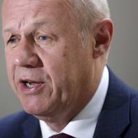First Secretary of State Damian Green speaks in London in August. Green has been asked to resign from the government by Prime Minister Theresa May Wednesday and admitted he made \"misleading\" statements about allegations pornography that was found on his Commons computer in 2008. | DAVID CHESKIN / PA / VIA AP, FILE