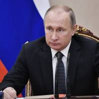 Russian President Vladimir Putin attends a Security Council meeting in Moscow Monday. | ALEXEI NIKOLSKY / SPUTNIK / KREMLIN POOL PHOTO / VIA AP