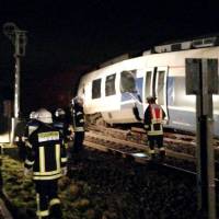 Rescue workers are at the site of train crash in Meerbusch west of Duesseldorf, Germany, Tuesday in this picture obtained from social media. | FEUERWEHR MEERBUSCH / VIA REUTERS