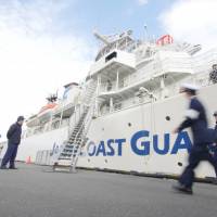 Japan Coast Guard members at their base in Maizuru, Kyoto Prefecture, prepare the cutter Daisen for departure. | AARON BERMAN