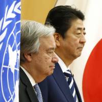 U.N. Secretary-General Antonio Guterres and Prime Minister Shinzo Abe review an honor guard before their meeting at the Prime Minister\'s Office in Tokyo on Thursday. | AP