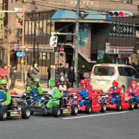 Tourists decked out in \"Mario Kart\" costumes and driving rented go-karts will soon be required to fasten their seat belts after a spate of accidents. | MAGDALENA OSUMI
