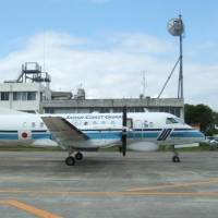 A mechanic died Friday after getting pinned by the wing of this Japan Coast Guard plane at Kagoshima airport. | 10TH REGIONAL COAST GUARD HEADQUARTERS / VIA KYODO