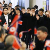 Members of the North Korean men\'s national soccer team are greeted by compatriots upon arriving at Tokyo\'s Haneda airport on Tuesday for the E-1 Football Championship tournament. | KYODO