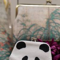 A panda-shaped coin purse and a bell said to make sounds like “Xiang Xiang” are displayed at a department store near Ueno Zo. | CHISATO TANAKA