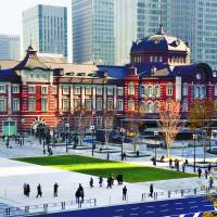People walk across a new plaza on the Marunouchi side of Tokyo Station on Thursday. The plaza provides easier access to the Imperial Palace. Construction on the project, a collaboration between JR East and the Tokyo Metropolitan Government, began in 2014. | SATOKO KAWASAKI