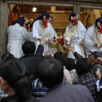 Foul mouths allowed: Priests dressed as goblins hand out lucky charms during the Akutai Festival. | AP