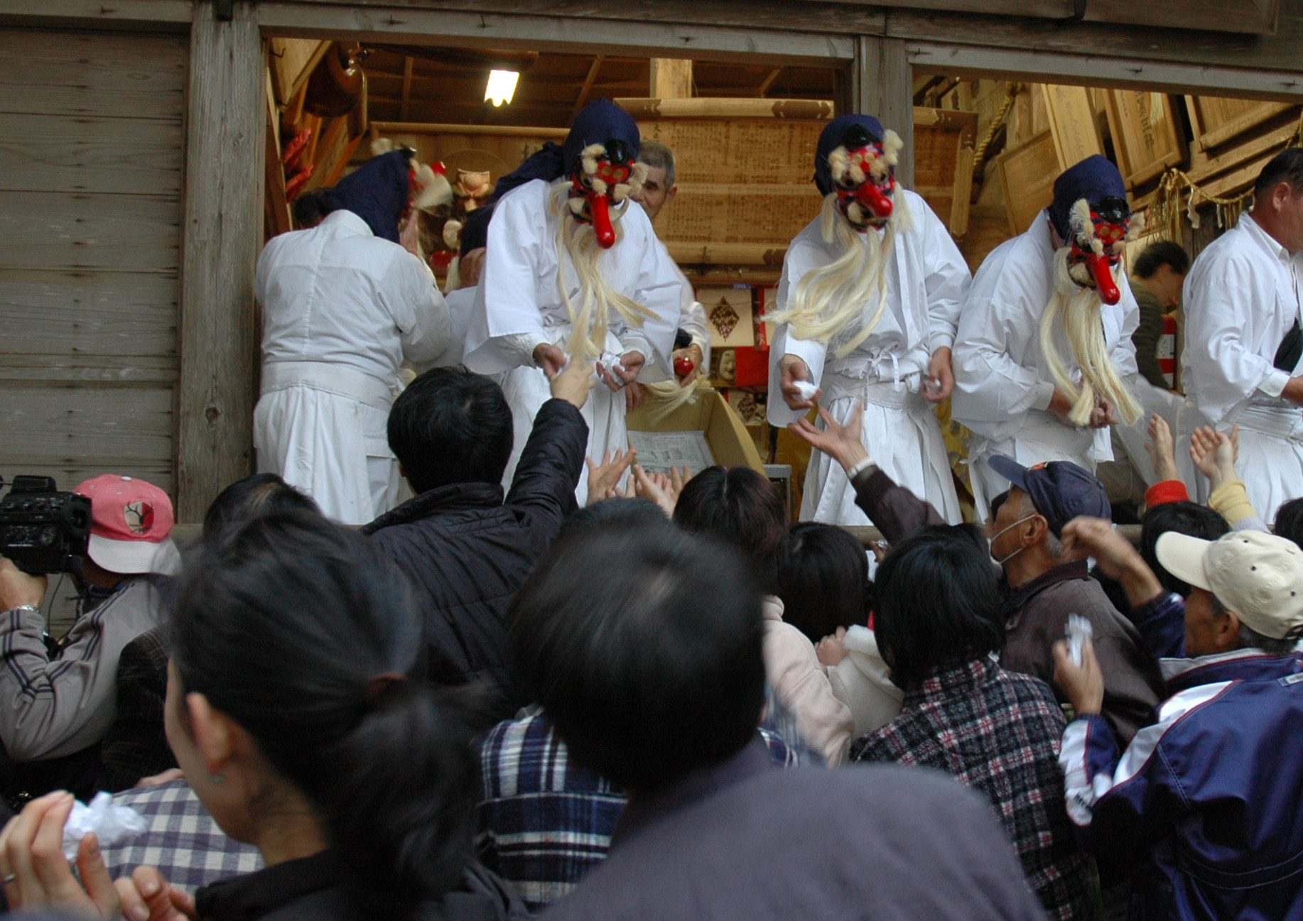 Foul mouths allowed: Priests dressed as goblins hand out lucky charms during the Akutai Festival. | AP