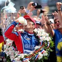 Fuel for the champ: Takuma Sato celebrates his Indy 500 victory with a traditional swig of milk. | USA TODAY SPORTS / VIA REUTERS