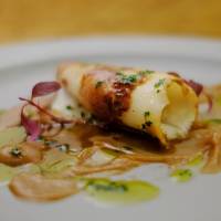Grilled squid with chestnut sauce is on the menu at Txiki Plaka in Tokyo\'s Shinbashi district. | LUUVU HOANG