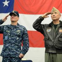 U.S. Navy Rear Adm. Marc H. Dalton (left), commander of Expeditionary Strike Group 7, and Navy Adm. Harry Harris salute aboard the USS Bonhomme Richard at a June 29 ceremony marking the start of Talisman Saber, a biennial joint military exercise between alliance partners Australia and the United States. | NAVY MEDIA CONTENT SERVICES
