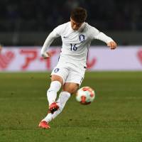 South Korea\'s Jung Woo-young scores on a free kick on Saturday. | AFP-JIJI