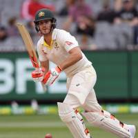 Australia batsman Mitchell Marsh plays a shot on the final day of the fourth Ashes test on Saturday in Melbourne, Australia. | AFP-JIJI