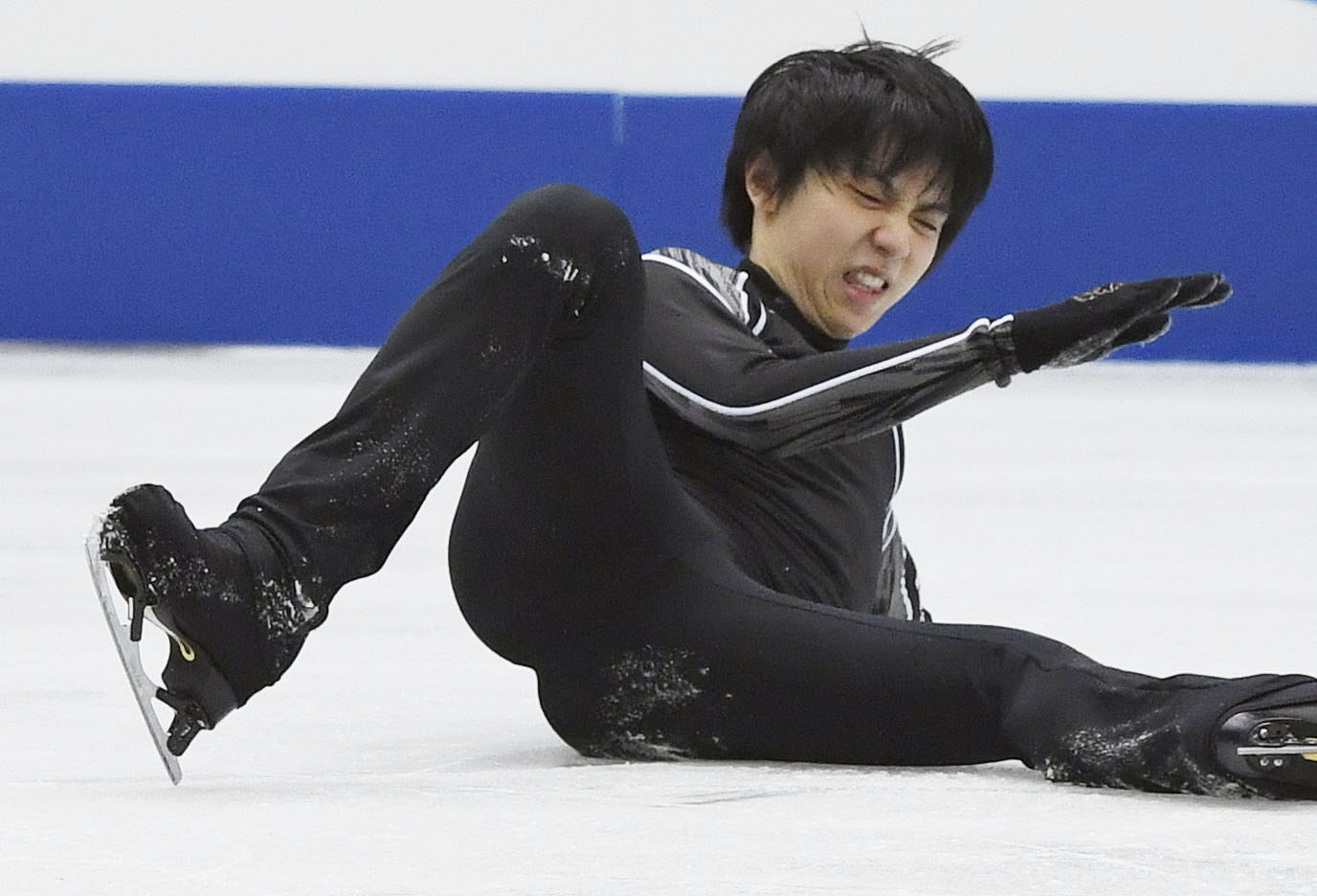 Yuzuru Hanyu falls while attempting a quad lutz during practice ahead of the NHK Trophy on Nov. 9. Hanyu was injured in the fall and hasn't competed since. The Japan Skating Federation announced Monday that Hanyu will miss the national championships because of the injury. | KYODO