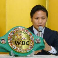 WBC flyweight champion Daigo Higa speaks at a news conference on Tuesday. | KYODO