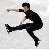 Nathan Chen performs during the men\'s short program at the Grand Prix Final in Nagoya on Thursday. Chen leads the field with 103.32 points. | REUTERS