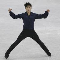 Nathan Chen performs to \"Mao\'s Last Dancer\" in the men\'s free skate at the Grand Prix Final on Friday in Nagoya. Chen took the title with 286.51 points, edging Shoma Uno by less than one point. | AP