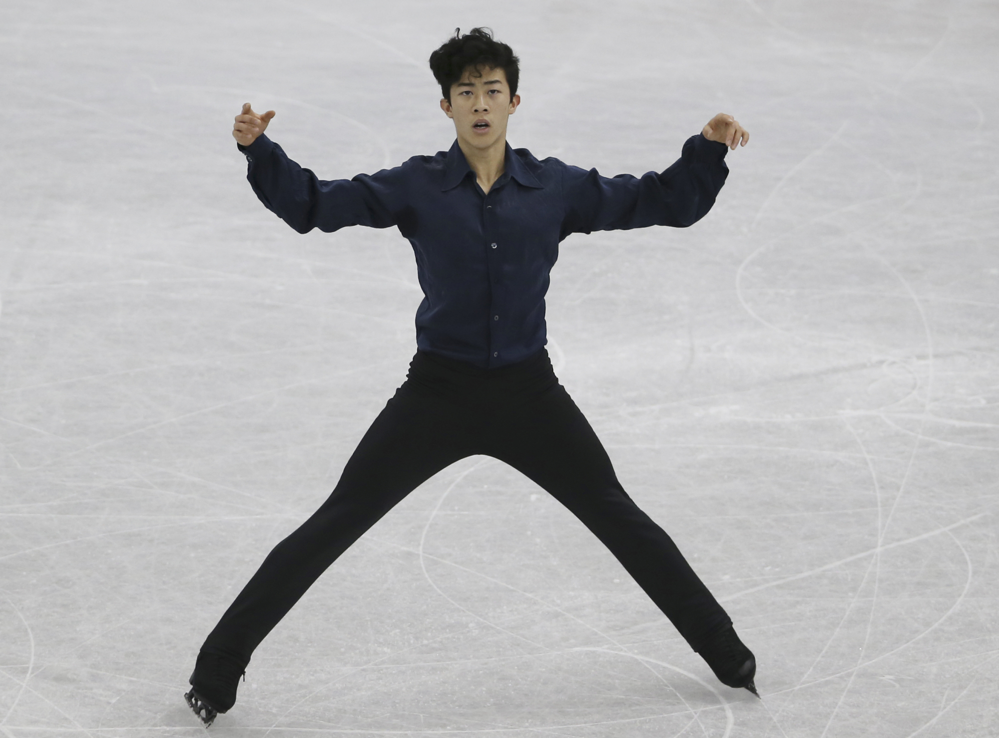 Nathan Chen performs to 'Mao's Last Dancer' in the men's free skate at the Grand Prix Final on Friday in Nagoya. Chen took the title with 286.51 points, edging Shoma Uno by less than one point. | AP
