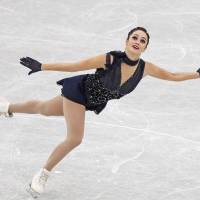 Canada\'s Kaetlyn Osmond skates in the women\'s short program at the Grand Prix Final on Friday in Nagoya. Osmond sits in first place with 73.04 points. | REUTERS
