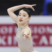 Rika Kihira skates to \"Kung Fu Piano\" in the women\'s short program at the Junior Grand Prix Final. Kihira sits in fourth place with a personal-best 66.82 points. | KYODO