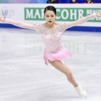 Satoko Miyahara performs her short program at the Grand Prix Final on Friday night. Miyahara is in third place with 74.61 points. | KYODO