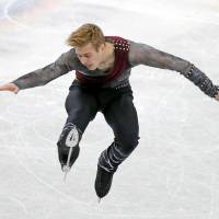 Alexei Krasnozhon of the United States performs his free skate routine at the Junior Grand Prix Final on Friday in Nagoya. Krasnozhon finished first 236.35 points over two days. | REUTERS
