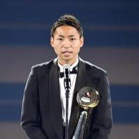 Kawasaki Frontale\'s Yu Kobayashi accepts his J. League MVP award on Tuesday. | KYODO