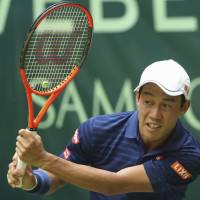 Kei Nishikori plays a shot during a match at the Gerry Weber Open in Halle, Germany, on June 22. | AP