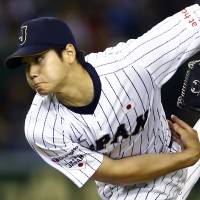 Shohei Otani met representatives from the Texas Rangers, Seattle Mariners and Chicago Cubs on Tuesday, according to U.S. media. | AP