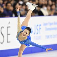 Satoko Miyahara competes in the free skate on Saturday evening at the All-Japan Championships. | KYODO