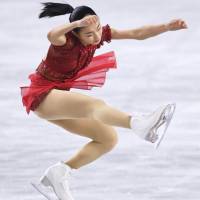 Kaori Sakamoto, who finished as the women\'s runner-up, performs to \"Amelie\" in the free skate on Saturday. | KYODO