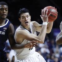 George Washington guard Yuta Watanabe, seen playing against Xavier on Nov. 23, scored his 1,000th career point in a win over Morgan State on Nov. 29. | AP