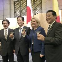 Romanian Ambassador Tatiana Losiper (second from right), poses for a photograph with (from left) Upper House lawmaker Ichiro Aisawa, Komeito leader Natsuo Yamaguchi and Akihisa Nagashima, secretary-general of the Japan-Romania Parliamentary Friendship League during a reception at Hotel Okura Tokyo on Nov. 27 to celebrate the country\'s national day. | RINA HASEGAWA