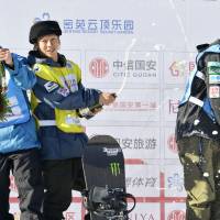 Snowboarders Ayumu Hirano (center), Yuto Totsuka (right) and Raibu Katayama, who placed first, third and second, respectively, in the men\'s halfpipe at a World Cup event Thursday in Zhangjiakou, China, celebrate their success. | KYODO