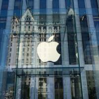 The Apple logo is seen at the entrance to the Fifth Avenue Apple store in New York in 2016. Apple announced Wednesday it would pay some &#36;38 billion in taxes &#8212; likely the largest payment of its kind &#8212; on profits repatriated from overseas as it boosts investments in the United States.The iPhone maker said in a statement it plans to use some of its foreign cash stockpile of more than &#36;250 billion, which qualifies for reduced tax rates under a recent bill, to invest in new projects, with estimated investments of &#36;75 billion in the U.S. | AFP-JIJI