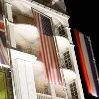 National flags of the United Kingdom, United States of America, France and Russia hang in front of the Steigenberger Belvedere hotel in the Swiss mountain resort of Davos Thursday. | REUTERS