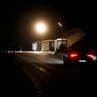 A car drives past a military checkpoint that will be used for the upcoming World Economic Forum (WEF), on the Wolfgangpass mountain pass road near the Swiss mountain resort of Davos Thursday. | REUTERS