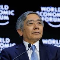Bank of Japan Gov. Haruhiko Kuroda looks on as he attends the World Economic Forum\'s annual meeting in Davos, Switzerland, on Friday. | REUTERS