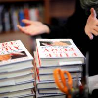 Copies of the book \"Fire and Fury: Inside the Trump White House\" by author Michael Wolff are seen at a local book store in Washington Friday. | REUTERS