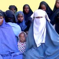 Remaining girls who were kidnapped from the northeast Nigerian town of Chibok are seen in an unknown location in Nigeria in this still image taken from an undated video obtained on Monday. | BOKO HARAM HANDOUT / SAHARA REPORTERS / VIA REUTERS