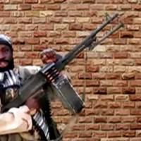The leader of one of the Boko Haram group\'s factions, Abubakar Shekau, holds a weapon in an unknown location in Nigeria in this still image taken from an undated video obtained on Monday. | BOKO HARAM HANDOUT / SAHARA REPORTERS / VIA REUTERS