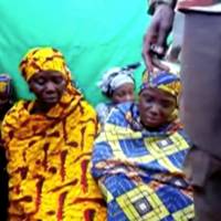 Remaining girls who were kidnapped from the northeast Nigerian town of Chibok are seen in an unknown location in Nigeria in this still image taken from an undated video obtained on Monday. | BOKO HARAM HANDOUT / SAHARA REPORTERS / VIA REUTERS