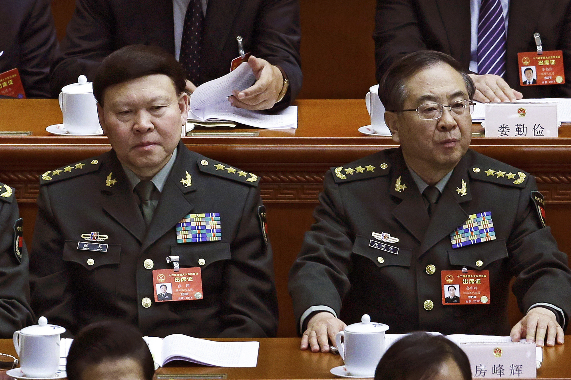 Gen. Fang Fenghui (right), the then-chief of the general staff of the Chinese People's Liberation Army, and Gen. Zhang Yang, the then-head of China's People's Liberation Army political affairs department attend the China's National People's Congress at the Great Hall of the People in Beijing in March. | AP