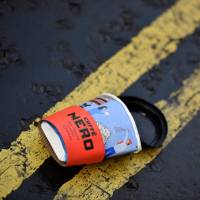 A discarded coffee cup lies in a central London road on Friday. | AFP-JIJI
