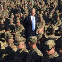 Defense Secretary Jim Mattis talks to troops at an outdoor movie theater at Guantanamo Bay, Cuba, on Dec. 21. The unannounced visit was the first by a defense secretary since Donald Rumsfeld visited in January 2002 shortly after the first prisoners arrived from Afghanistan. | AP