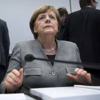 German Chancellor Angela Merkel attends a faction meeting of her conservative bloc in Berlin on Jan. 16. | AP
